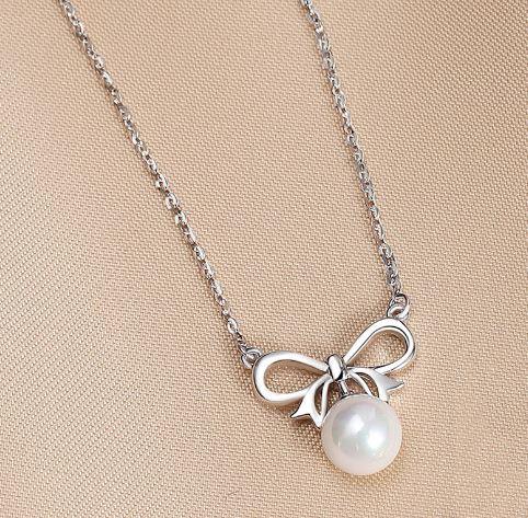 Enchanted Golden Bow and Pearl Elegance Necklace - OneCatBoutique